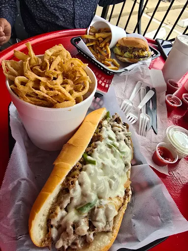 Cheesesteak, onion strings and burger spread