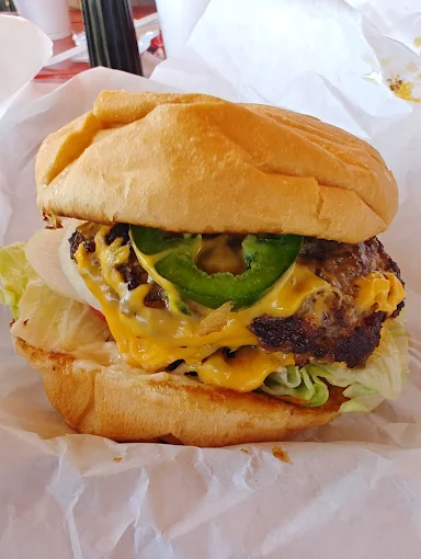 Signature spicy burger with jalapeño